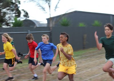 Five student running during competition